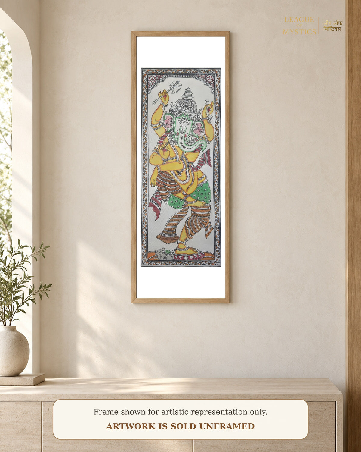 Dancing Ganesha Pattachitra shown framed on a wall, mint & gold colourway