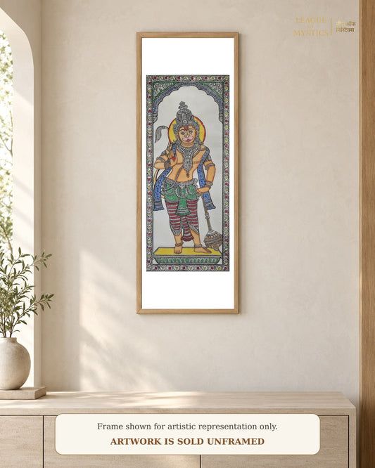 Hanuman Ji Pattachitra shown framed on a wall, saffron colourway
