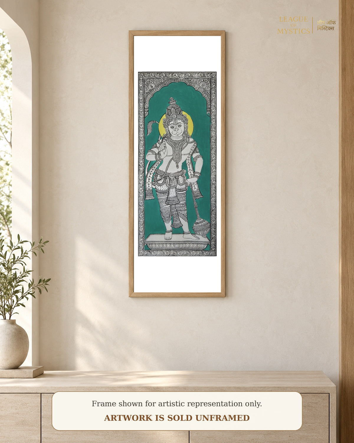Hanuman Ji Pattachitra shown framed on a wall, teal colourway